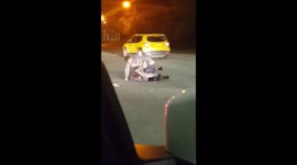 Drunk men fall out taxi and fight in the middle of a busy road