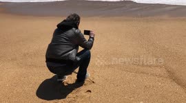 Man filming Atlantic Ocean