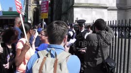 Two Windrush protesters get arrested by police for chucking paint at people near Westminster Abby London by Jim Connor