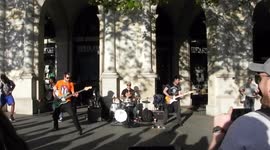 Busking heavy rock band entertain the crowds on the corner of the Strand and Trafalgar square in London By Jim Connor