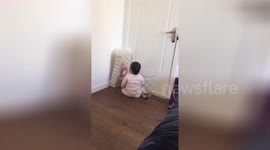 Toddler fights pack of toilet rolls