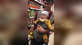 Baby in South Korean supermarket laughs hysterically during game of peekaboo