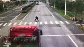 Lorry takes out traffic lights before crashing into river to avoid scooter
