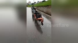 Man uses unconventional method to transport metal rods in Vietnam