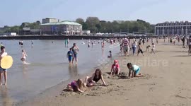 Kid surfing and Pedalos, Weymouth