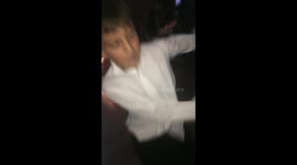 Kid making a funny Fornite dance in a wedding reception