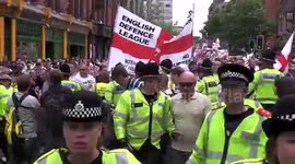 English Defence League supporters line the streets of Birmingham in protest