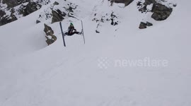 Female skier attempts spread eagle jump but fails spectacularly