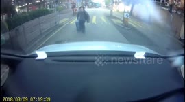 Woman lunges in front of car in epic insurance scam fail