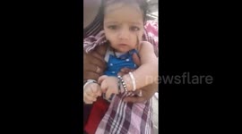 Monkey loves human babies, can’t stop petting them