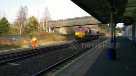 Diesel locomotive connecting to carriages at Swindon station