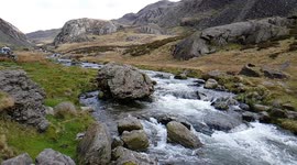 Slow-mo footage captures Snowdonia river flowing though mountains