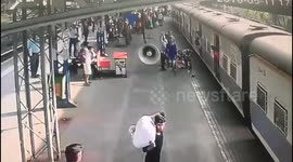 Heart-stopping moment cop saves girl from slipping under train