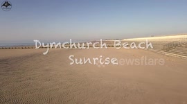 DYMCHURCH BEACH AT SUNRISE ON A SUNNY BANK HOLIDAY