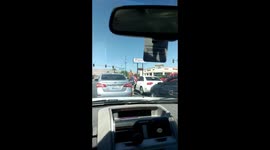 Two girls, one cop. Street fight in Las Vegas.