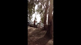 Kid swings and spins on a rope