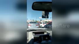 Newsflare Edit - Two girls, one cop. Street fight in Las Vegas.