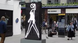 Walking neon sign in Carnaby St London by Jim Connor