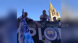 Pep Guardiola chucks beer to fan during Manchester City parade