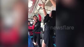 Woman gets hand stuck in handrail on bus