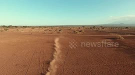 Motorcycles kick up dust in Kenya