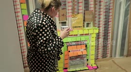 Boyfriend wraps girlfriend's living room in office stationery