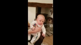 Four-week-old baby slightly put out at dad's sneeze