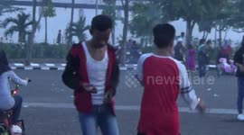 Indonesian teenagers mark start of Ramadan with firecracker battle