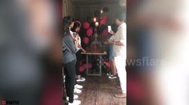 This is the moment a woman was horrifically burned after balloons filled with hydrogen exploded in a fireball while she was lighting her 21st birthday cake.