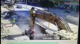 2 workmen buried under rubble as road collapses
