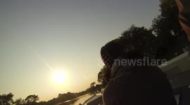Sunrise boat ride in the Brazilian Pantanal with waves