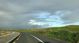 Irish countryside, green grass and cloudy sky