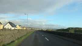 Irish countryside, green grass and cloudy sky