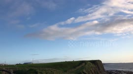 Irish countryside, green grass and cloudy sky