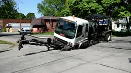 Pothole Killer sinks in a sinkhole