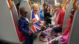 Train passengers have fun on early train en route to royal wedding