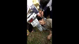 Rescue the drunk man trapped in motorbike exhaust