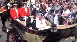 Harry and Meghan ride past in horse-drawn carriage