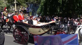 Harry and Meghan pass through Windsor in royal carriage