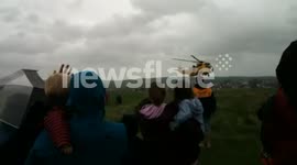 Coastguard helicopter taking off from the downs (Bude Lifeboat day)