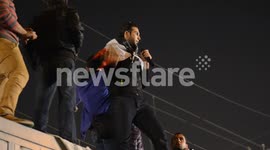 Protesters wave the Egyptian flag and chant against President Mohamed Morsi