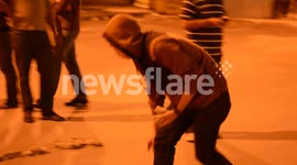 Young Egyptians write 'Leave Morsy' in stones outside presidential palace