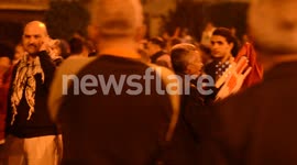 Elderly man sells Egyptian flags to protesters