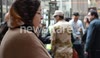 Egyptians queue outside the entrance of a polling station during constitutional referendum