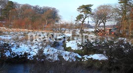 farmers tractor  in the snow on dartmoor