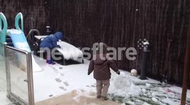 Kids playing with the snow in Barcelona