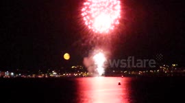 Plymouth fireworks competition with moon rising