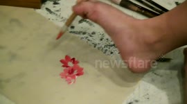 Armless man creates traditional Chinese painting with feet