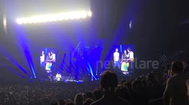 Paul McCartney marries a couple during show
