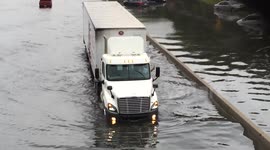 Cars stranded on flooded motorway in New York